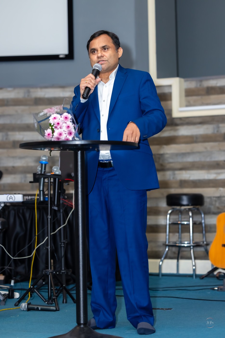 Pastor Jonathan Naik preaching
